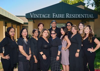 Employees outside of Vintage Faire Residential sign